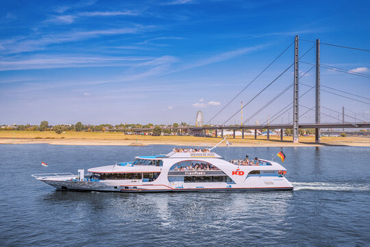 23 July 2022, Dusseldorf, Germany: Koln - Dusseldorf cruise ship transports tourists and passengers on deck and in comfortable cabins by Rhine river