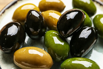 Plate with delicious olives, closeup