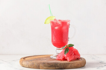 Fototapeta Wooden board with glass of cold watermelon fresh on light background obraz