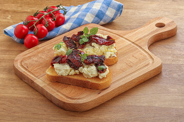 Bruschetta with soft cheese and tomato