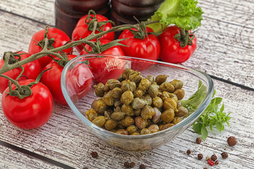 Marinated green capers in the bowl