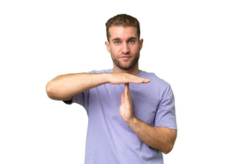 Young handsome blonde man over isolated background