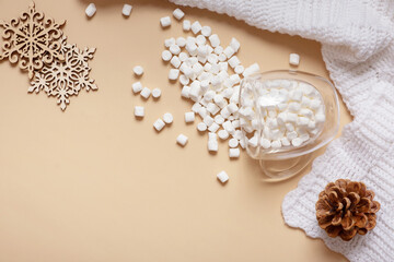 Christmas hugge flat lay composition with cup of marsh mellow, snowflakes top view