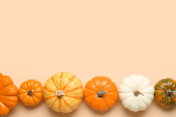 Ripe pumpkins for Halloween party on color background