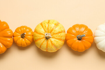 Ripe pumpkins for Halloween party on color background