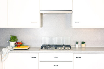 Home decor concept, clean kitchen in apartment decoration with white modern cabinet and counter. 