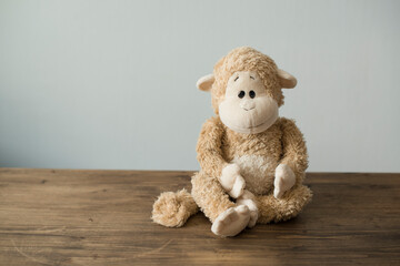 Soft children's toys monkey sitting on the table