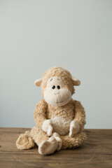 Soft children's toys monkey sitting on the table