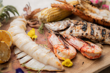 grilled chicken wings BBQ  grilled seafood on the table