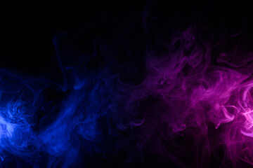 Fototapeta premium Flowing clouds of colorful swirling blue and purple neon smoke dark abstract background