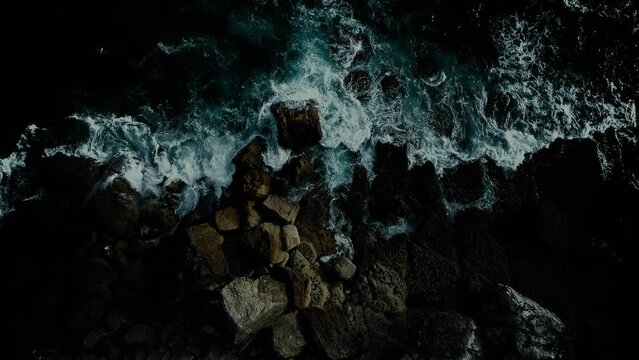 Sea Waves crashing on the rocks at Night