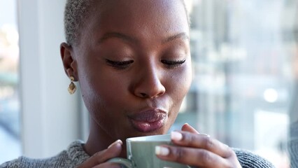 Coffee drink, relax home and black woman thinking of idea, happy in house and smile in the living room of apartment. Face of an African person drinking warm tea and calm in lounge for breakfast - Powered by Adobe