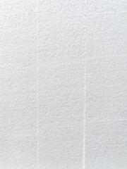 Fototapeta premium Close-up of the background of the white polystyrene foam structure with vertical stripes