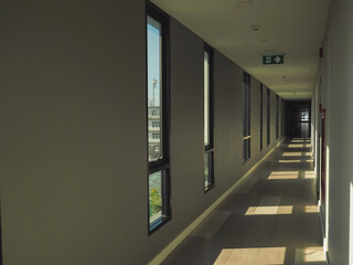 Hallway with glass windows in condominium