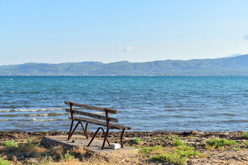 Naklejka na ściany i meble bench on the coast of the sea