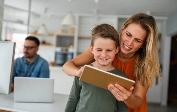 Distance learning, online education, home work concept. Family with digital devices at home. - Powered by Adobe