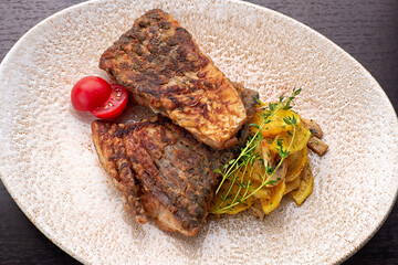 Fried fish with fried potatoes and mushrooms