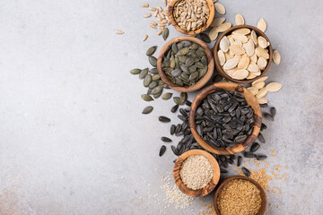 Bowls with different seeds as ingredient for oil and healthy meal