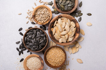Fototapeta na wymiar Bowls with different seeds as ingredient for oil and healthy meal