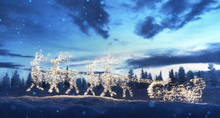 Christmas garland lights illumination of reindeer sleigh in snow