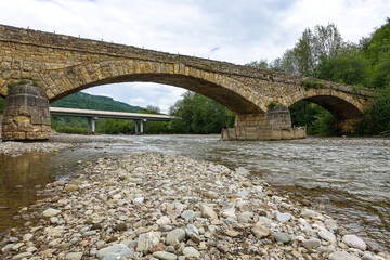 Fototapeta na wymiar Dakhovsky picturesque stone bridge over the Dakh River Adygea. Russia. 2021.