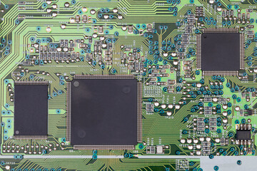 Green printed fax motherboard with microcircuit, close-up
