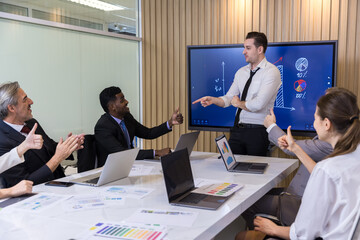 Fototapeta premium Diverse colleagues gather in brainstorm discuss statistics together. Group of people colleagues gather doing Brainstorming business plan together. Team Brainstorm Working Concept. 