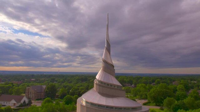 Slow motion of the spire of the temple at sunset in Independence Missouri with the Church of Christ, Community of Christ, Remnant and The Church of Jesus Christ of Latter-day Saints (Mormon)