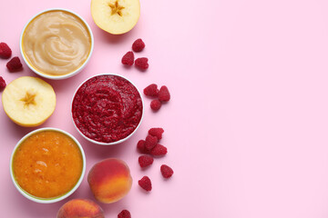 Different puree in bowls and fresh ingredients on pink background, flat lay. Space for text