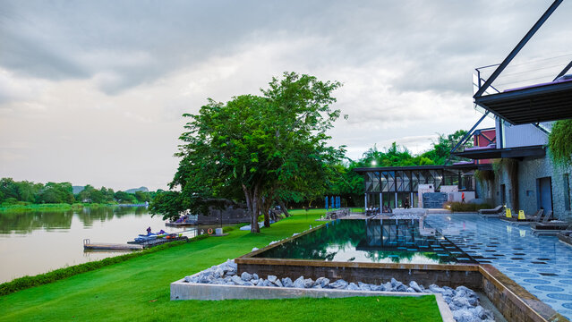 Kanchanaburi Thailand August 2022, a luxury resort alongside the River Kwai, is popular for kayaking on the river. Luxury swimming pool at Cross River Kwai