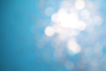 Shiny turquoise background with magical bokeh effect