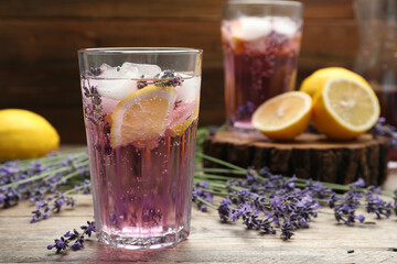 Fresh delicious lemonade with lavender on wooden table. Space for text