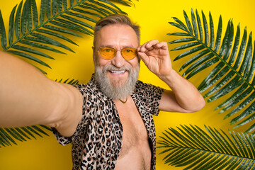 Photo portrait of nice granddad video recording tropical jungle dressed stylish leopard print...