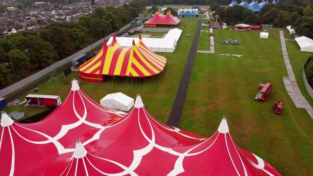 Ascending Aerial Shot Above Very Colourful Festival Tents