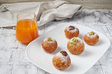 Brioche ball stuffed with sugar and orange juice