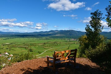 Lookout point over Javorniki hills and Sveta Trojica mountain near Pivka in Notranjska, Slovenia wooden bench with a heart shape