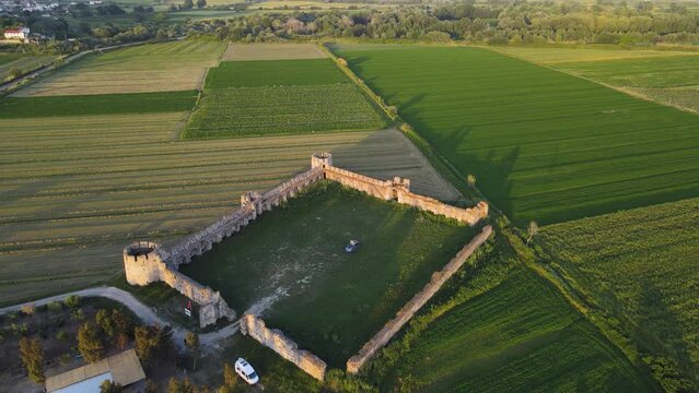A drone view of a very well-preserved quadrangular fortress in a plain near the mouth of the River Shkumbin, The Fortress of Bashtove, Albania.