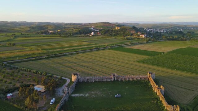 A view of a medieval quadrangular fortress The Fortress of Bashtov&euml;  is a located close to the outflow of the Shkumbin River into the Adriatic Sea in Central Albania.