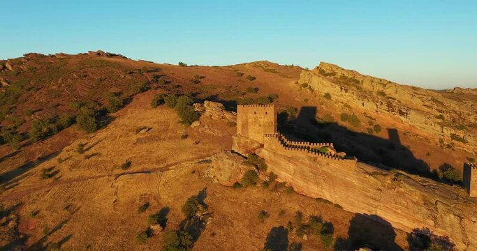 Majestic Sierra de Caldereros With Castillo de Zafra During Sunset In Campillo de Due&ntilde;as, Guadalajara, Spain. Aerial Drone Shot
