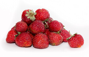 Strawberries on a white background. Strawberry close-up isolated. Juicy berries picked for dessert.
