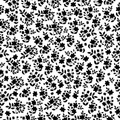 Floral pattern with small black flowers and  leaves on white background. Seamless pattern for design and fashion prints.Stock vector illustration.