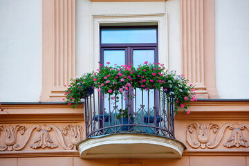 Round balcony with flowers. Flowers in planter box hanging on balcony railings.
