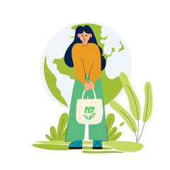 There is a woman with eco-friendly bag in her hands. She is going to buy groceries. She cares about the environment. Her bag with the text “ECO”. There is an abstract background.