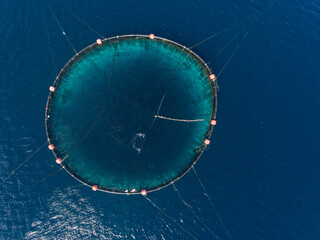 Aerial view of fish farm. Circle fishing nets in the Mediterranean Sea.