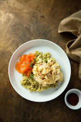 Scrambled eggs with couscous and smoked salmon