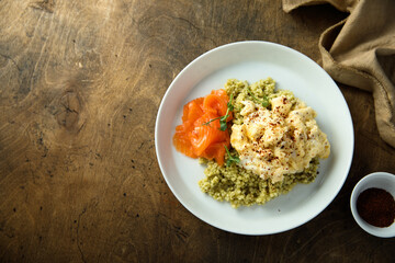 Scrambled eggs with couscous and smoked salmon