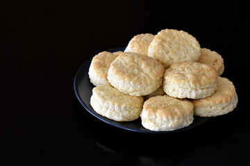 Scones on a plate.  Copy space is on the left side. 