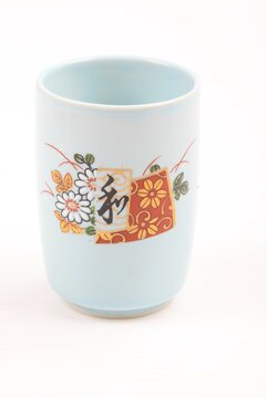 Asian ceramics tea cup on white background