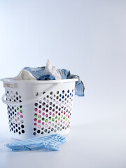 Basket with dirty clothes for washing
