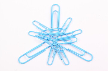 closeup blue paper clip on white background with clipping path
